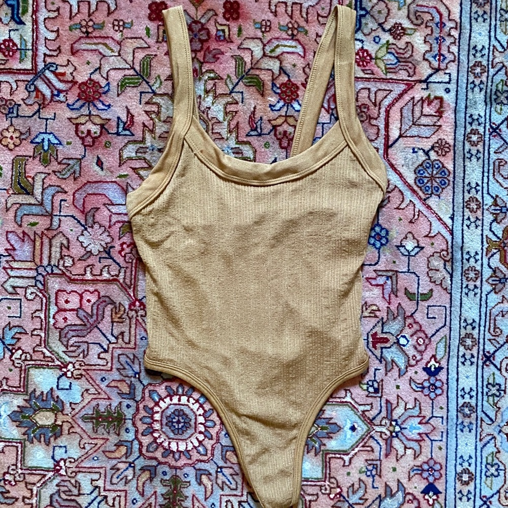 Brown body suit